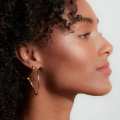 THOBY 18K AND SINGLE DIAMOND TUBULAR HOOP EARRING